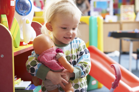 Young girl playing with toys